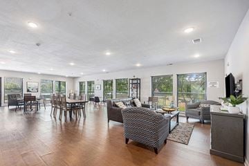 Grand Rapids apartment for rent - a living room and dining room with a table and chairs