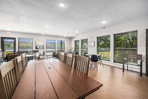 Grand Rapids apartment for rent - a large dining room with a large wooden table and chairs