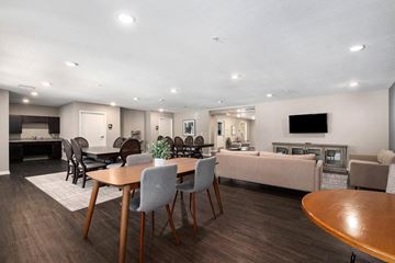 Grand Rapids apartment for rent - a dining room and living room with a table and chairs