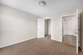 Grand Rapids apartment for rent - a bedroom with a closet and a door to a hallway
