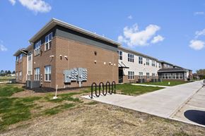 Wilton apartment for rent - a brick building with a bike rack in front of it