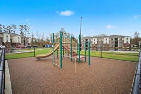 Cherryville apartment for rent - A playground with a slide and a green pole.