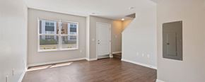 Pontiac apartment for rent - A room with a door and a window with a view of a building.