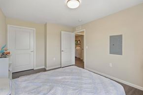 Ashland apartment for rent - a bedroom with a large bed and a door to a bathroom