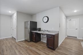 Columbus apartment for rent - a kitchen with a refrigerator and a sink