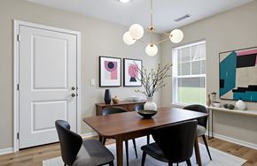 Madison apartment for rent - A dining room with a wooden table and chairs.