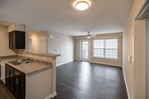 Cedar Rapids townhouse for rent - an empty kitchen and living room with a large window