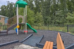 Denmark apartment for rent - a playground with a slide and other toys in a park