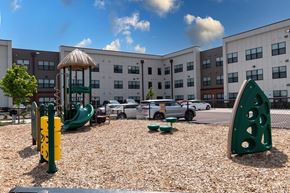 Indianapolis apartment for rent - a playground in front of a building