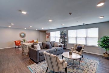 Indianapolis apartment for rent - a living room with couches and chairs and a table