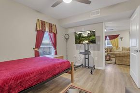 Columbus apartment for rent - a bedroom with a bed and a mirror in a room