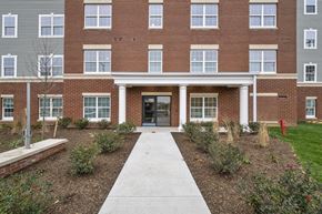 Cleveland apartment for rent - A brick building with a white door and windows.