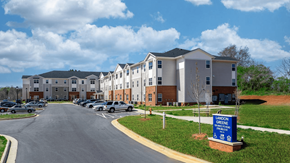 Statesville apartment for rent - an apartment building with cars parked in front of it