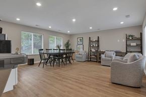 Barnesville apartment for rent - A living room with a wooden floor and a large window.