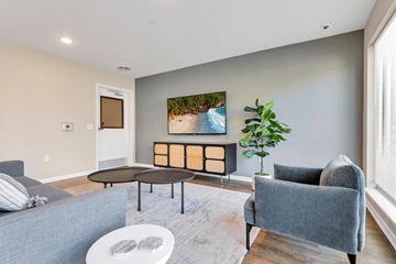 Columbus apartment for rent - a living room with couches and chairs and a tv