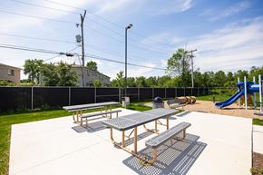 Columbus apartment for rent - A picnic table is in the middle of a playground.