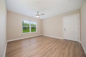 Columbus apartment for rent - A room with a white door and a ceiling fan.