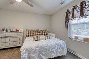 Calabash apartment for rent - a bedroom with a bed and a dresser