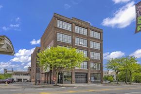 Cleveland apartment for rent - a large brick building with a tree in front of it
