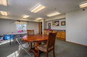 Fostoria apartment for rent - A dining room with a wooden table and chairs.