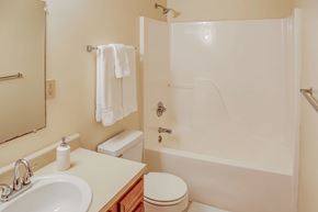 London apartment for rent - A white toilet sits next to a white sink in a bathroom.