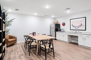 Marquette apartment for rent - A dining room with a table and chairs.
