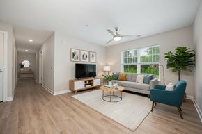 Columbus apartment for rent - A living room with a television, couch, and a plant.
