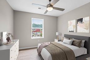 Charleston apartment for rent - a bedroom with a bed and a ceiling fan