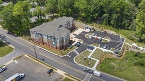 Statesville apartment for rent - An aerial view of a parking lot and a building with a red brick exterior.