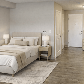 Washington Court House apartment for rent - A bedroom with a large bed and a nightstand with a lamp.