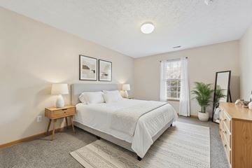 Cadiz apartment for rent - A bedroom with a bed, nightstand, and a window.