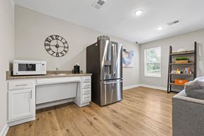 Statesville apartment for rent - A kitchen with a refrigerator, microwave, and sink.