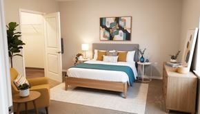 Columbus apartment for rent - A bedroom with a bed, nightstand, and chair.