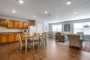 Wheeling apartment for rent - a living room and dining room with a table and chairs