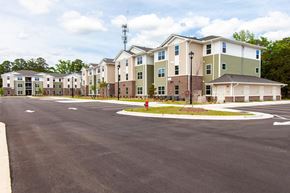 New Bern apartment for rent - an empty parking lot in front of an apartment building