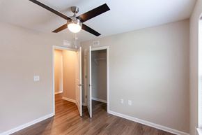 New Bern apartment for rent - a bedroom with a ceiling fan and a closet
