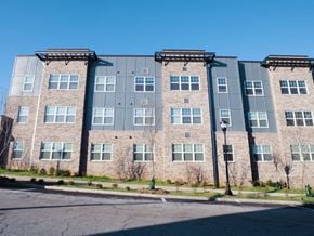 Atlanta apartment for rent - a brick apartment building with a blue sky in the background