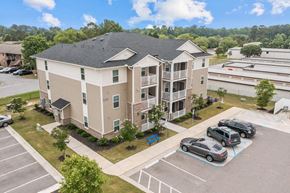 Greenville apartment for rent - an aerial view of an apartment building with cars parked in a parking lot