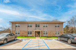 Tellico Plains apartment for rent - an office building with cars parked in front of it
