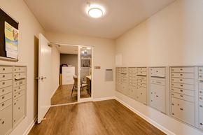 Johnston apartment for rent - a room with lockers and a table with chairs