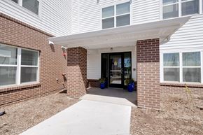 Johnston apartment for rent - a brick building with a glass door