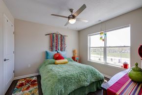 Johnston apartment for rent - a bedroom with a bed and a ceiling fan
