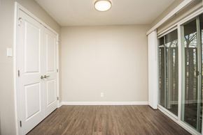 Tellico Plains apartment for rent - an empty living room with a door to a mirrored closet