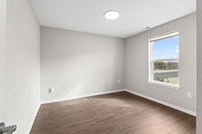 Noblesville apartment for rent - an empty room with wood floors and a window
