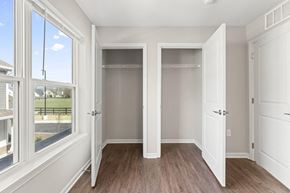 Noblesville apartment for rent - a bedroom with two closets and a window