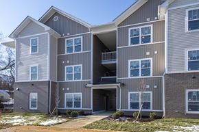 Lancaster apartment for rent - A modern two-story apartment building with a balcony on the second floor.