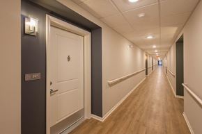 Columbus apartment for rent - A long hallway with a door on the left and a door on the right.
