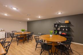 Columbus apartment for rent - A dining room with a wooden table surrounded by chairs.
