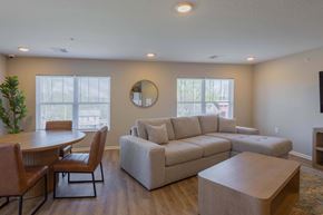 Zanesville apartment for rent - A living room with a couch, chairs, and a coffee table.