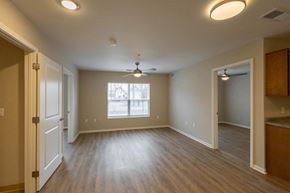 Columbus apartment for rent - A room with a ceiling fan and a window.